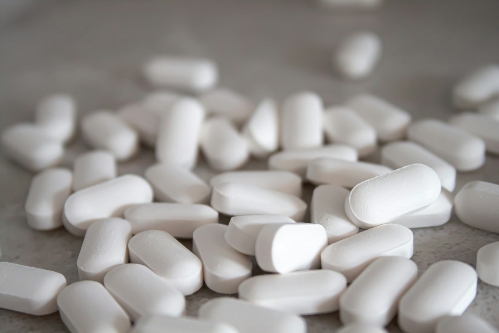 Scattered white tablets on a table